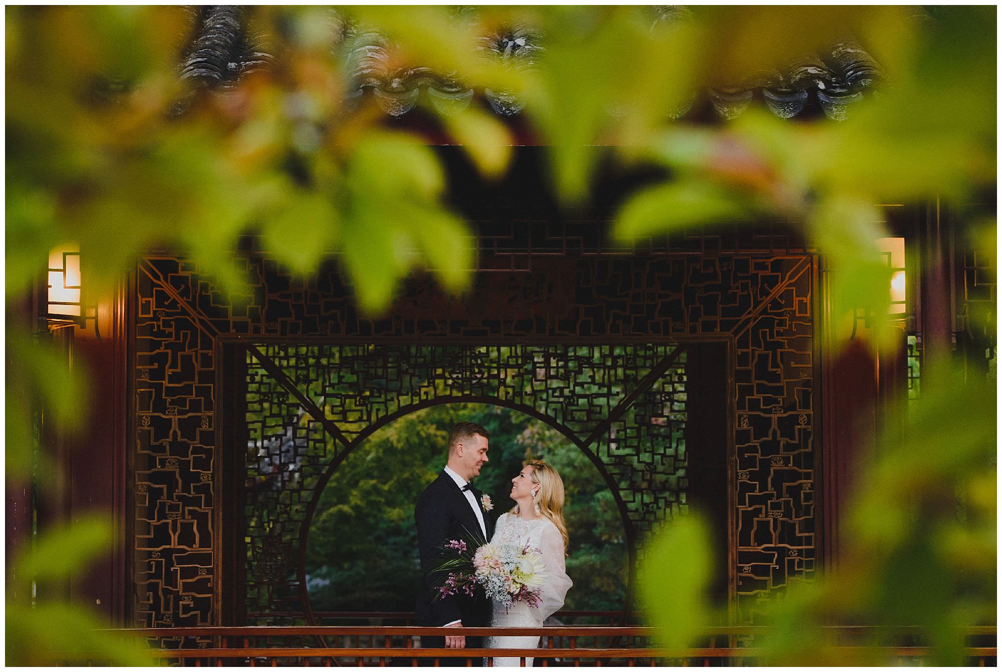 Bride and Groom laughing at sunset after their wedding ceremony at Dr. Sun Yat-Sen Classical Chinese Gardens, elopement, intimate wedding, candid wedding photography
